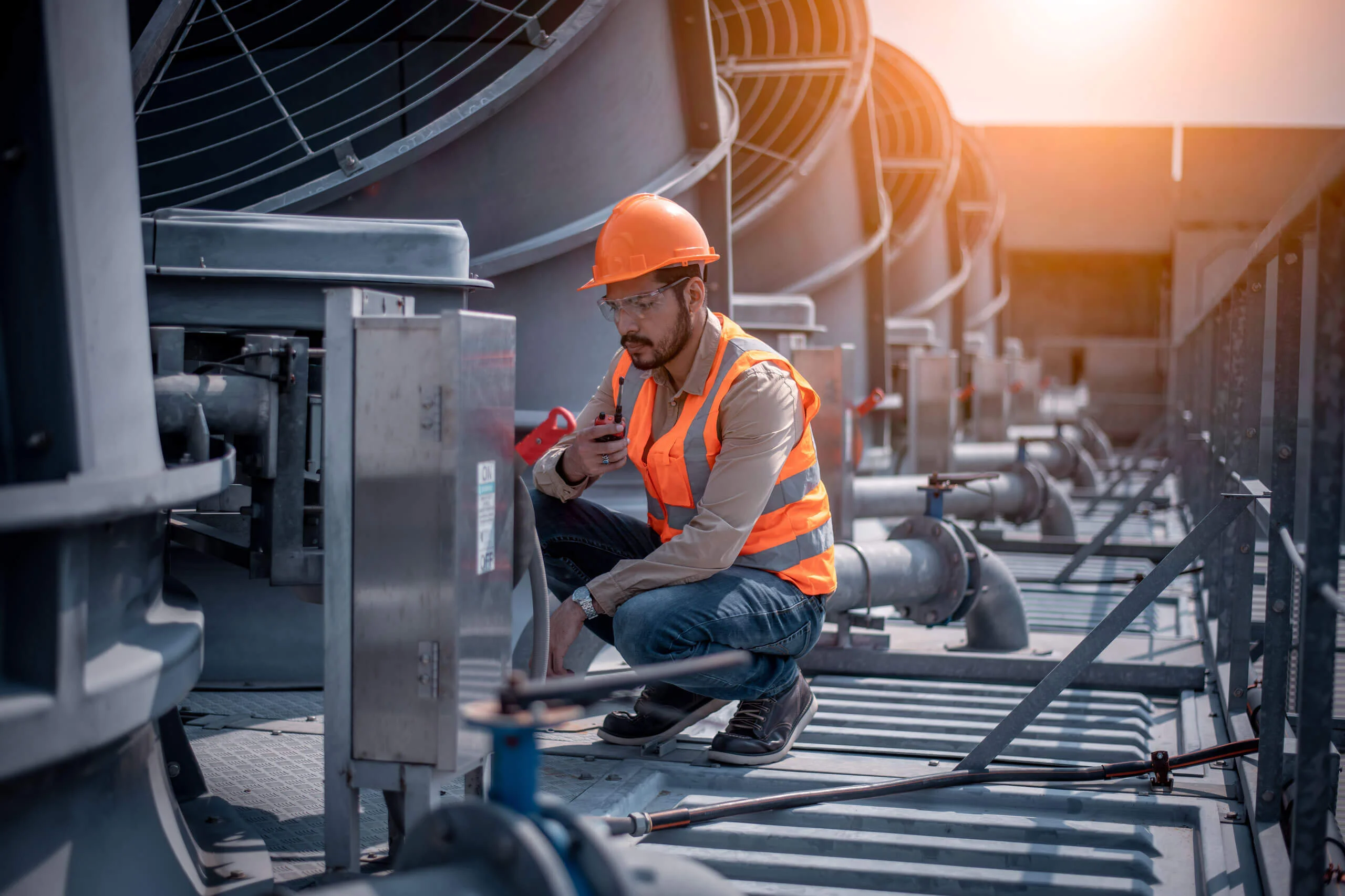 Professional HVAC technician servicing a commercial building