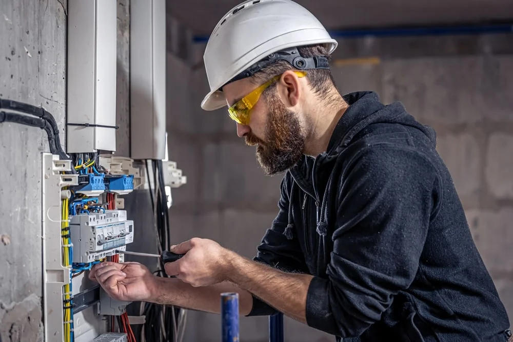 electrical technician working on system