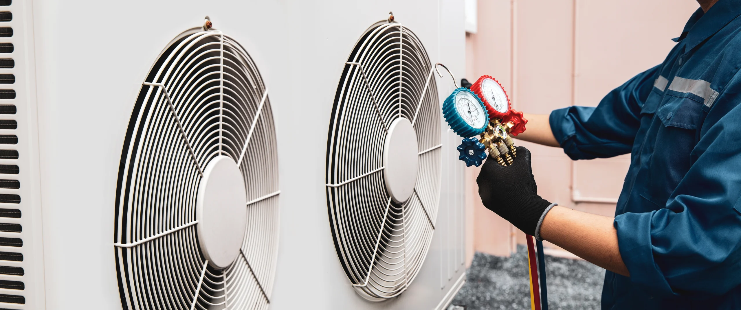 HVAC Technician working on AC unit