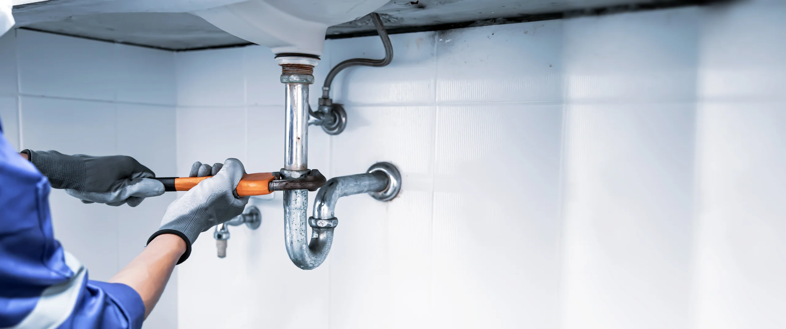 plumber fixing a pipe
